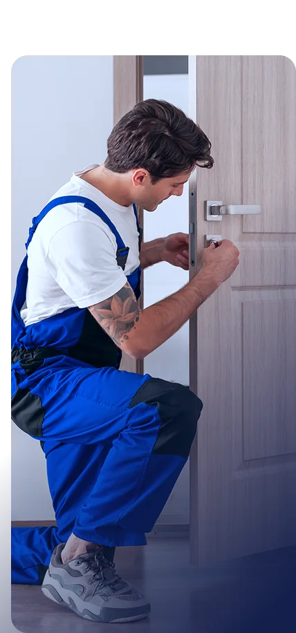 Locksmith in Dubai installing modern digital lock on wooden door for home security and maintenance